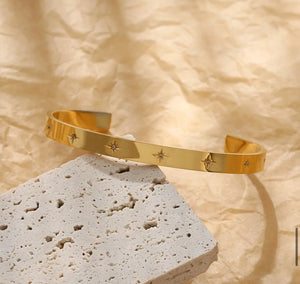 Cosmic gold torque bracelets