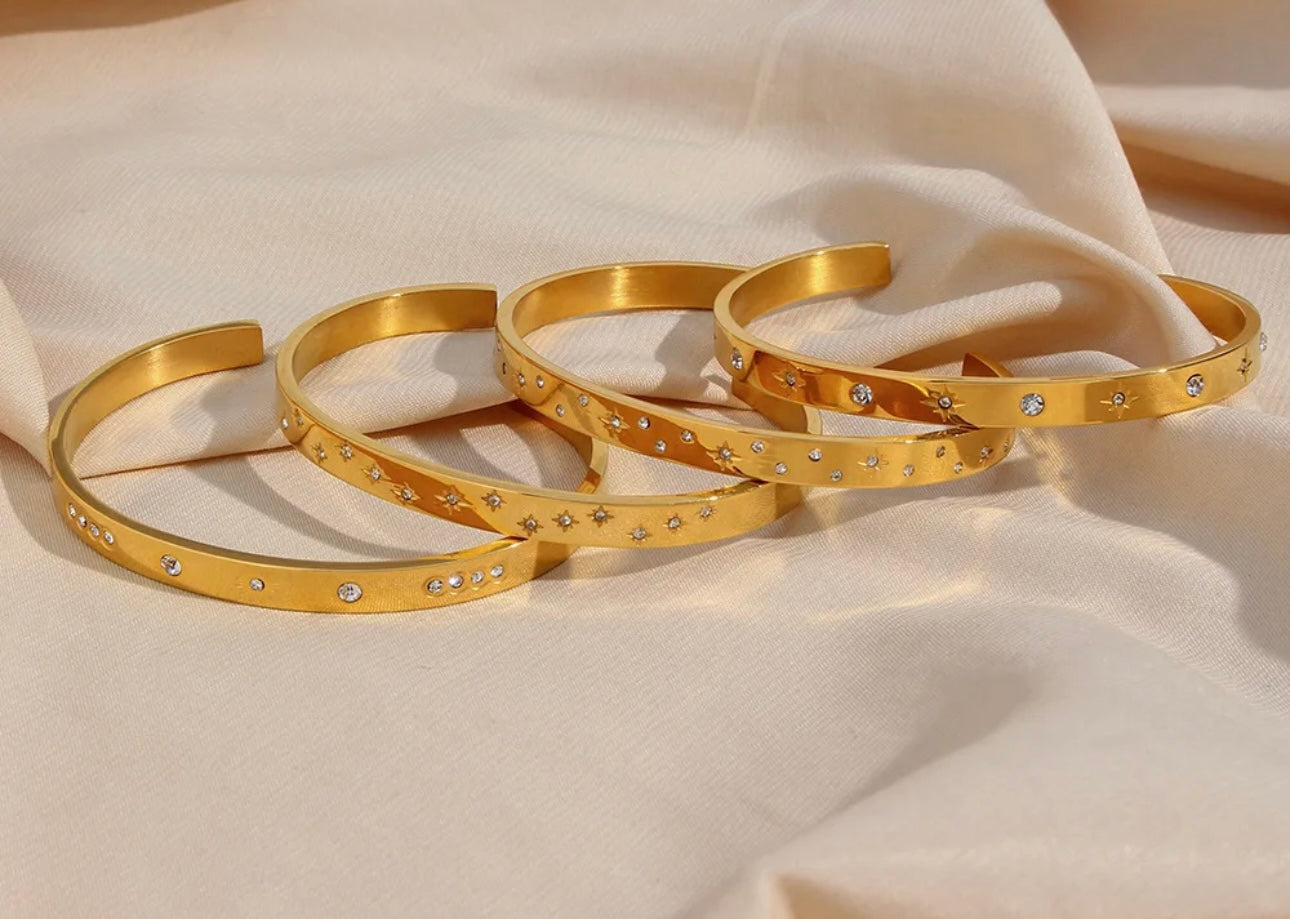 Cosmic gold torque bracelets